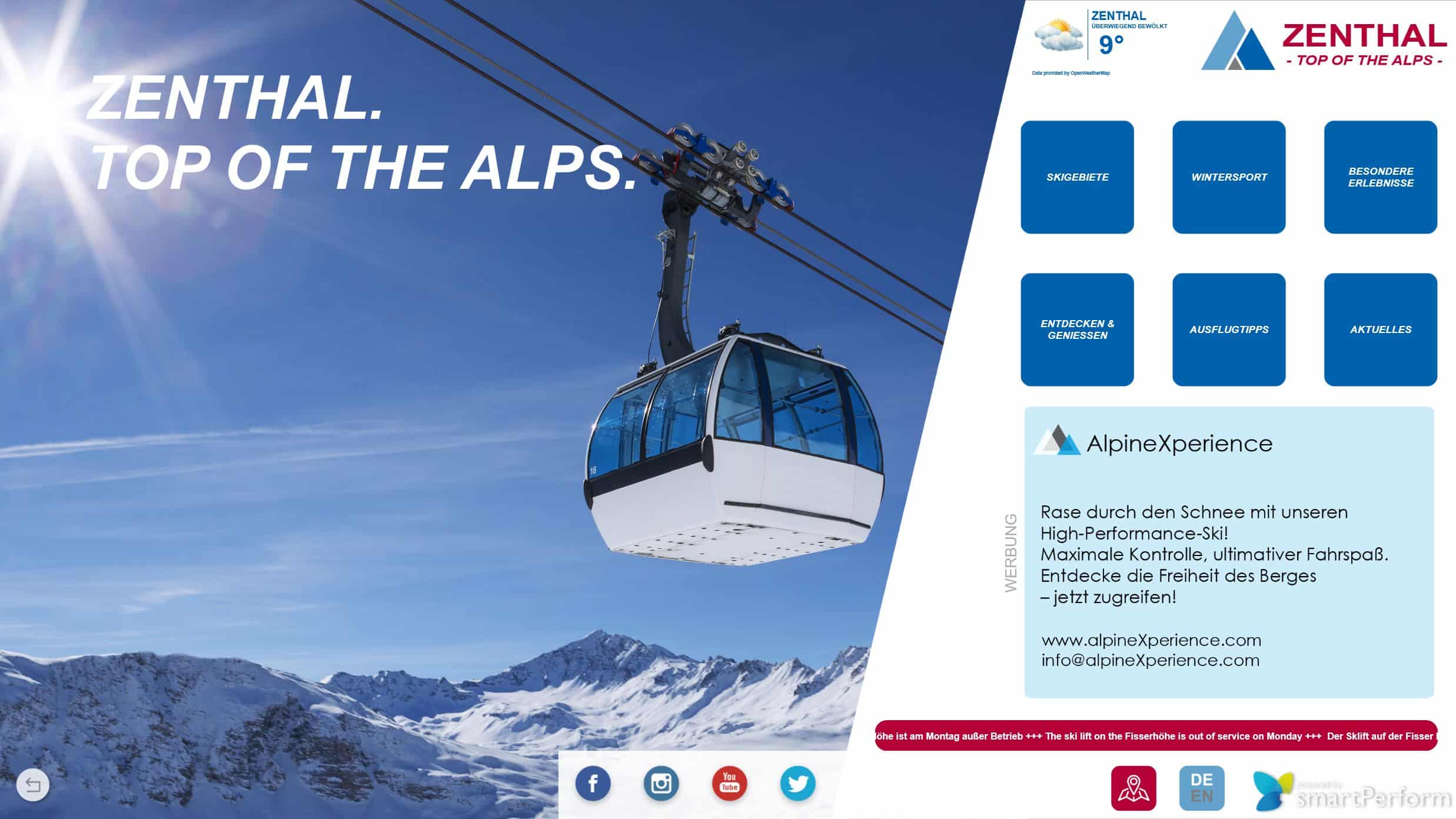 Seilbahn über schneebedeckten Alpen bei Sonnenschein